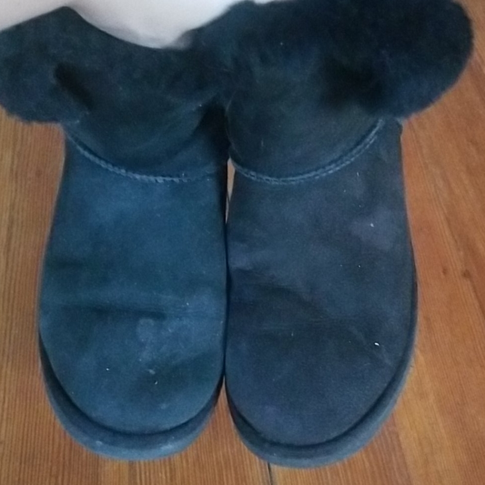 Black short uggs with button detail